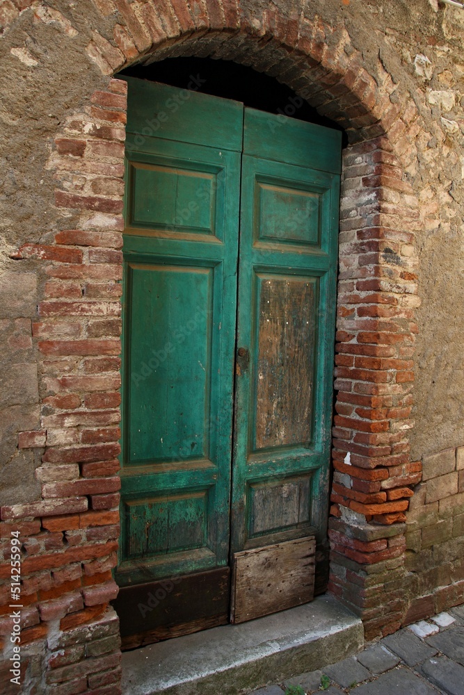 Italy, Tuscany: Old doorway of the stones house. Italy, Tuscany: Old doorway of the stones house.