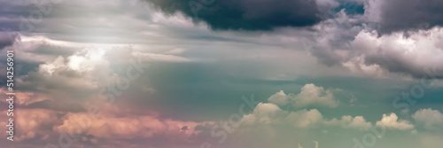 Fototapeta Dramatic sky with dark clouds over a field