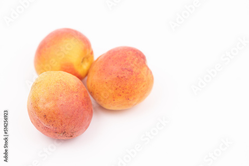 Fresh apricots isolated above white background with copy space