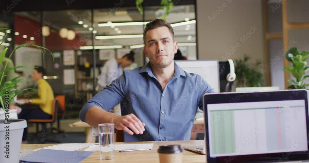 Portrait of happy caucasian businessman looking at camera at office Portrait of happy caucasian businessman looking at camera at office