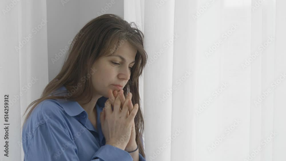 Lonely young woman at window missing her beloved, empty soul dreaming far away Lonely young woman at window missing her beloved, empty soul dreaming far away