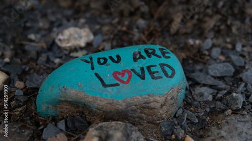 you are loved paint on a rock