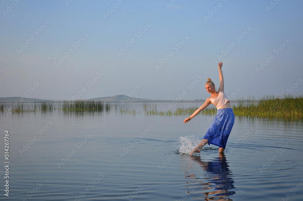 Young women travelling and resting outside city in summer mere lake Young women travelling and resting outside city in summer mere lake