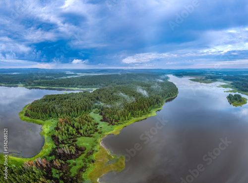 Fototapeta Naklejka Na Ścianę i Meble -  Big lake with green shores with morning fog in dawn, aerial landscape. Recreation concept. Aerial view