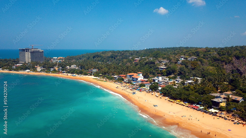 Beach coastline in Unawatuna, Sri Lanka. Popular destination for tourists visiting Sri Lanka. Situated close to Galle and Mirissa Beach coastline in Unawatuna, Sri Lanka. Popular destination for tourists visiting Sri Lanka. Situated close to Galle and Mirissa