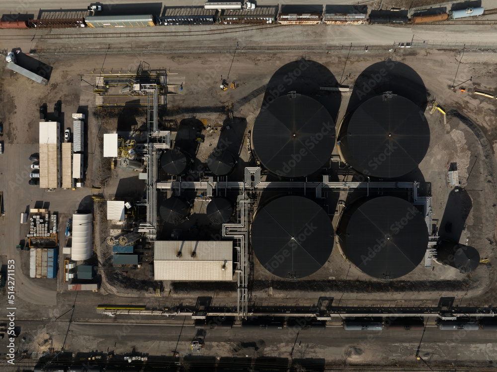 A direct overhead view above a new industrial manufacturing area, producing and storing petroleum asphalt.