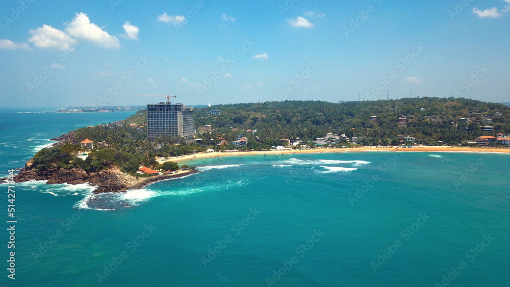 Beach coastline in Unawatuna, Sri Lanka. Popular destination for tourists visiting Sri Lanka. Situated close to Galle and Mirissa