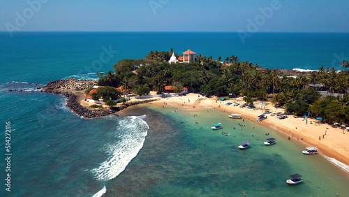 Beach coastline in Unawatuna, Sri Lanka. Popular destination for tourists visiting Sri Lanka. Situated close to Galle and Mirissa photo