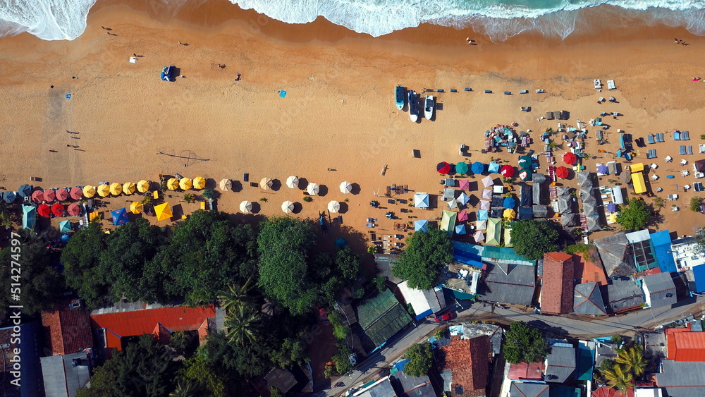 Obraz premium Beach coastline in Unawatuna, Sri Lanka. Popular destination for tourists visiting Sri Lanka. Situated close to Galle and Mirissa