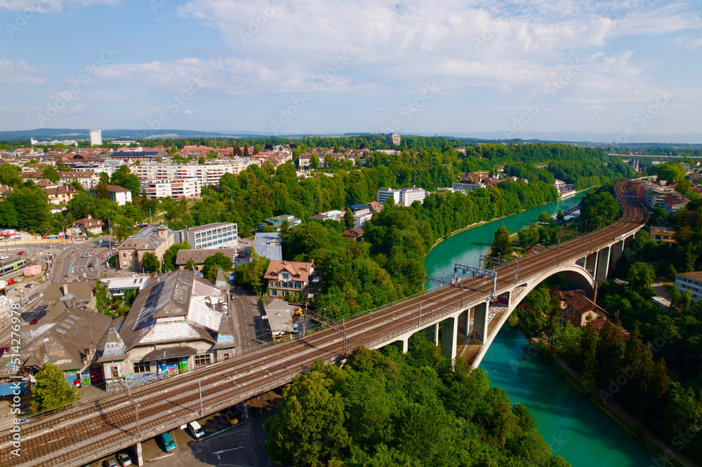 Aerial view of City of Bern, capital of Switzerland, with Lorraine Railway Viaduct over Aare River on a blue cloudy summer day. Photo taken June 16th, 2022, Bern, Switzerland.