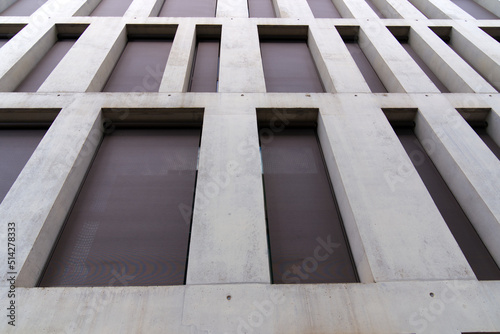 Close-up of modern concrete facade of office tower at City of Bern, capital of Switzerland, on a sunny summer day. Photo taken June 16th, 2022, Bern, Switzerland.
