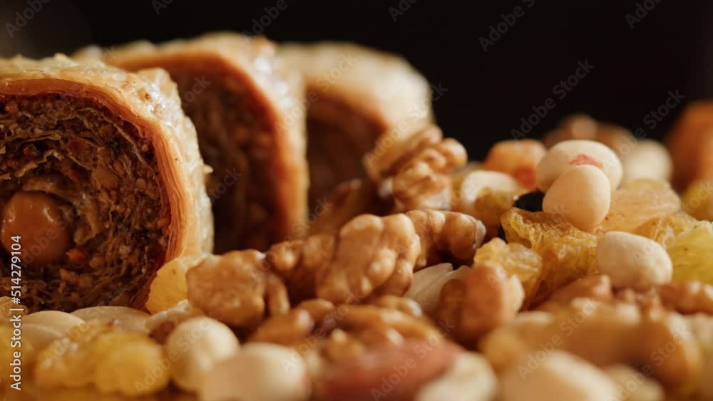 Turkish sweet dish, Baklava and nuts close-up. Arabian treats. Middle eastern national sugar food, dessert snack. Turkish sweet dish, Baklava and nuts close-up. Arabian treats. Middle eastern national sugar food, dessert snack.