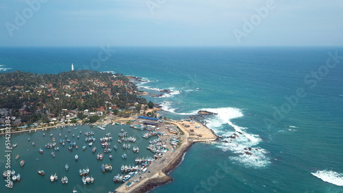 Small fishing harbour in the southern coast of Sri Lanka. Many small fishing boats parked till they go fishing again in the ocean. © Look4What