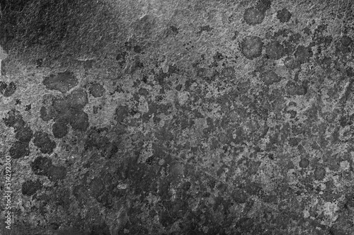 Wallpaper Mural Old dark gray wall with black spots. Textured natural stone background with real dark spots. Torontodigital.ca