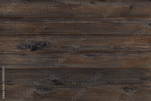Background of black wooden panels. dark burnt texture boards.
