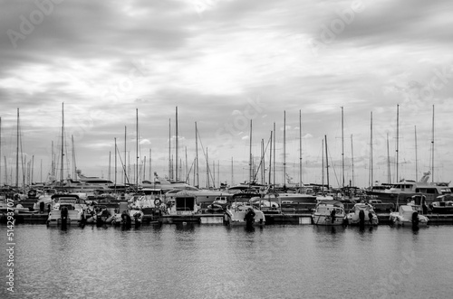 Sea port in which a large number of boats are moored during a cloudy sunset