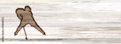 Silhouette of a hockey player in defensive position on a rectangular background with a wood texture in light gray-brown shades for text placement. Isolated element with wood burning effect.