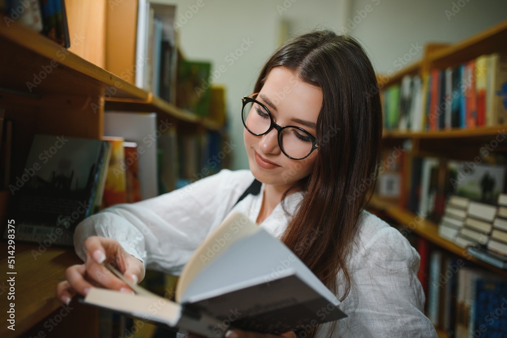 Beautiful girl in a library