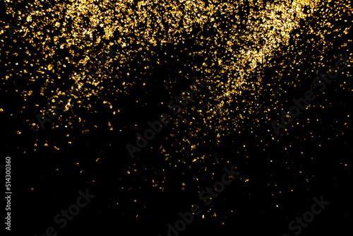 close up of the golden  glitte on black background