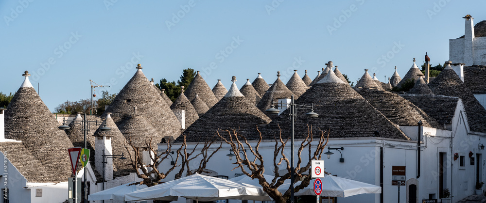 Fototapeta premium Scenic roofs of houses in historic Trulli district in Alberobello, Italy