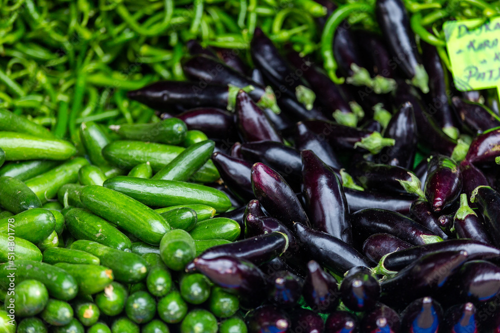 Cucumber, eggplant and pepper sold in the market place Cucumber, eggplant and pepper sold in the market place
