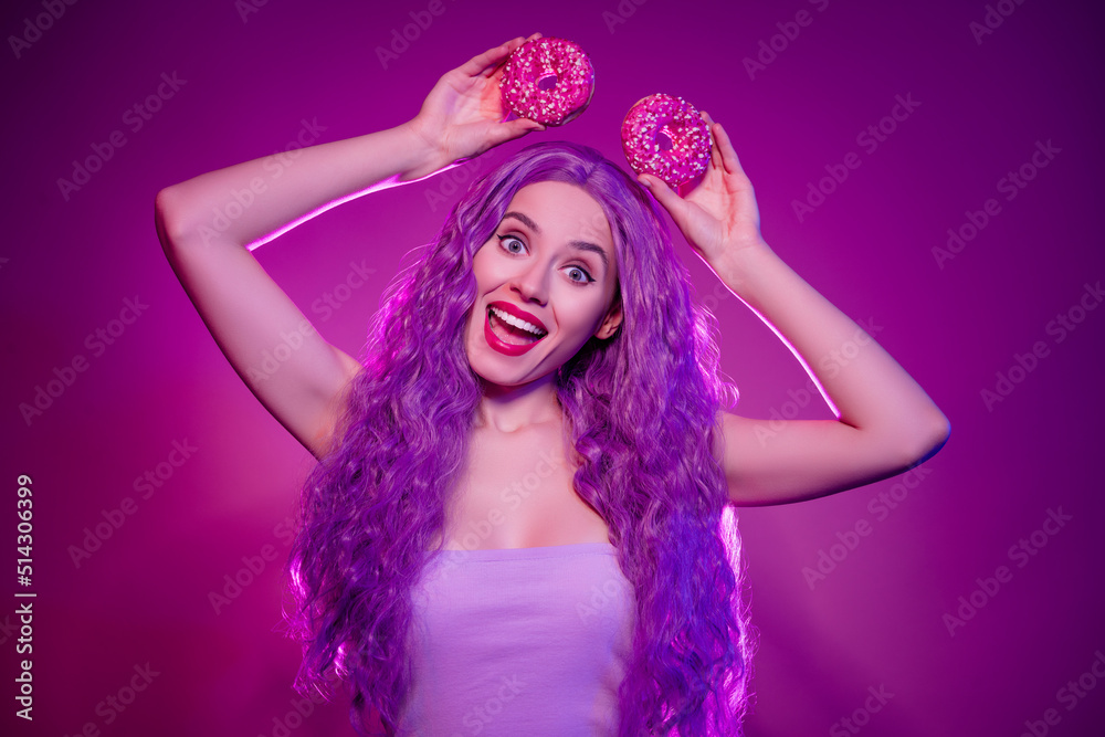 Photo of stunning minni mouse role play girly lady with long lilac purple wig curls hold two donuts like ears have fun