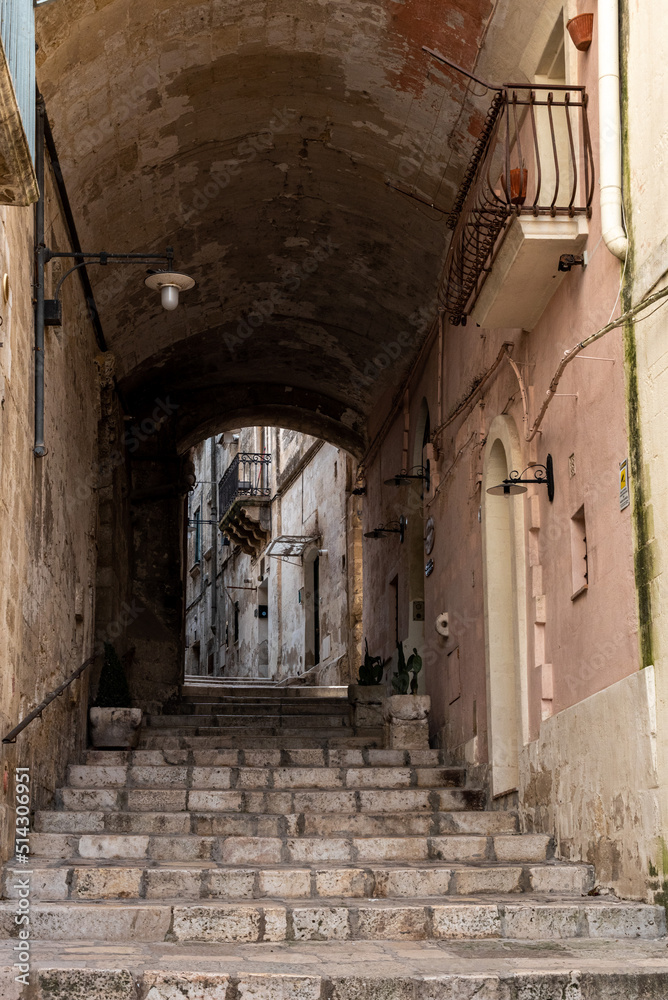 An empty staircase leading through a passage, somewhere in downtown Matera, Italy