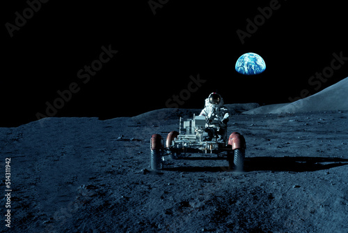 Fotografia An astronaut rides on a lunar rover on the moon
