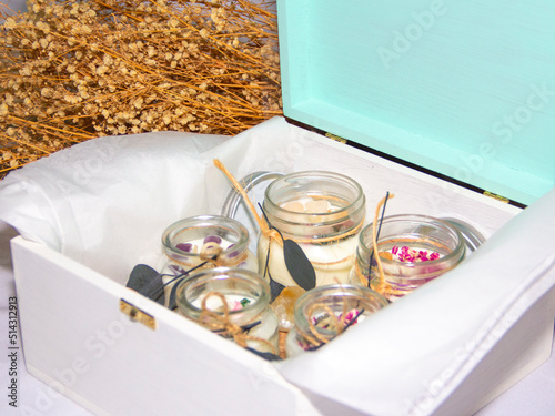 scented candles in glass jar with decorative elements
