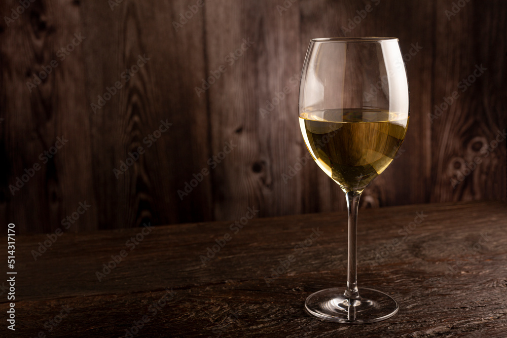 Glass of white wine on the table. Glass of white wine on the table.