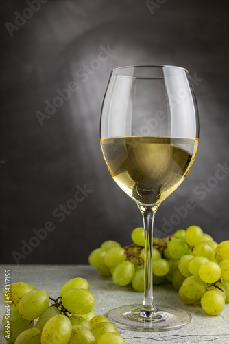 Glass of white wine on the table.