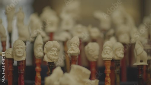 Close-up shot of man making handmade meerschaum pipe