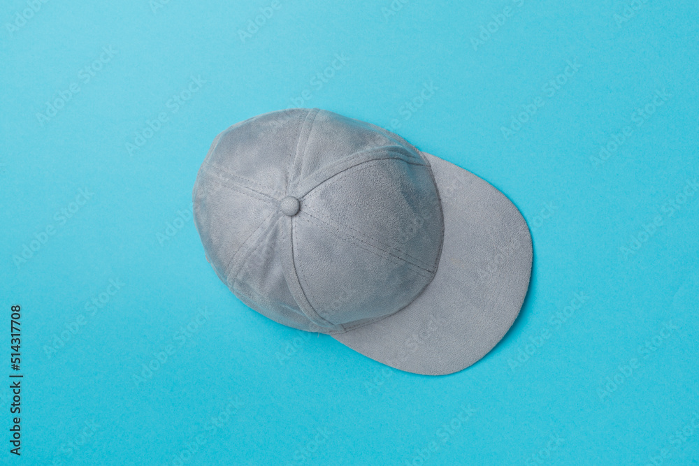 Blue cap on color background, top view Blue cap on color background, top view