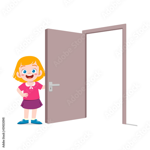 little kid standing and holding door knob