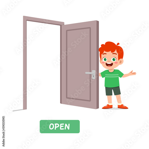 little kid standing and holding door knob