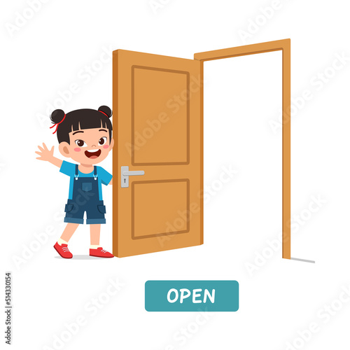 little kid standing and holding door knob