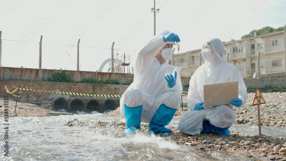 Two officials are investigating dead marine life from chemically contaminated water. Two officials are investigating dead marine life from chemically contaminated water.