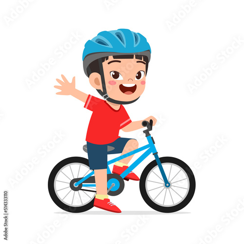 Fototapeta Naklejka Na Ścianę i Meble -  little kid ride bike and wear helmet