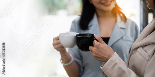 Two Young asian business woman have coffee break at office. finance and accountant Concept.