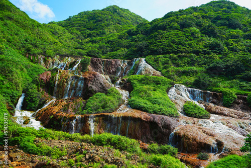 Golden Waterfall, formed by the interaction of groundwater and iron sulfide ore. It is close to the popular tourist village of Jiufen, on the northeastern coast of Taiwan.