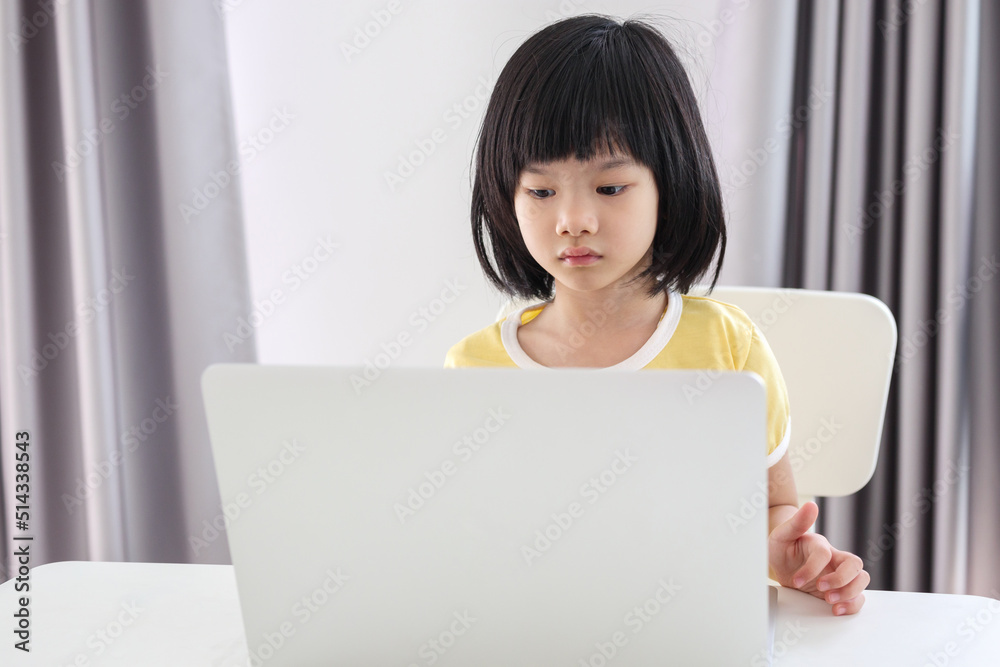 little asian girl student study online using laptop computer at home little asian girl student study online using laptop computer at home