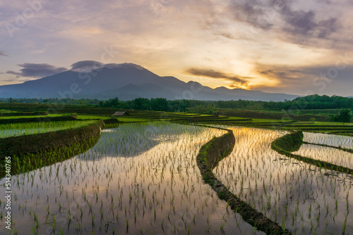 the view of the reflection of the morning sun shining on the mountain area and rice terraces