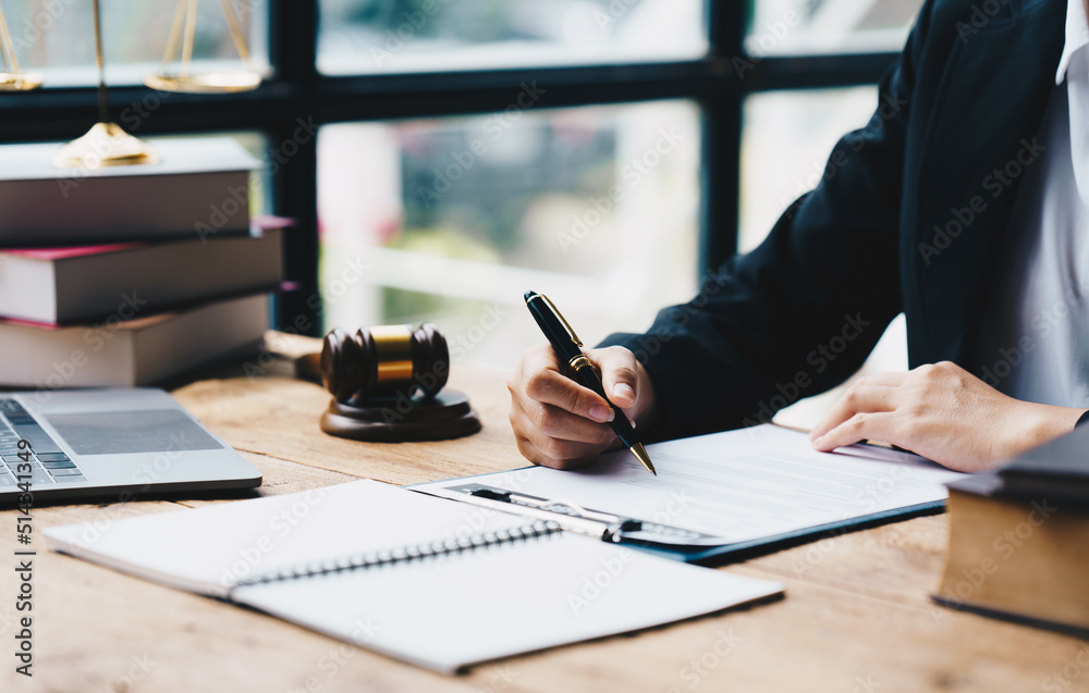 Businessman in suit or lawyer working on a documents. Legal law, advice and justice concept, Judge gavel with Justice lawyers. Businessman in suit or lawyer working on a documents. Legal law, advice and justice concept, Judge gavel with Justice lawyers.