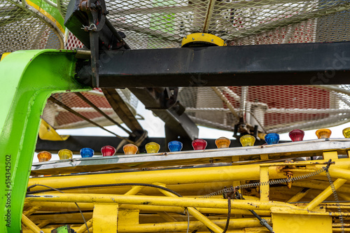 Carnival ride being setup at a rural fair in the summer for amusement.