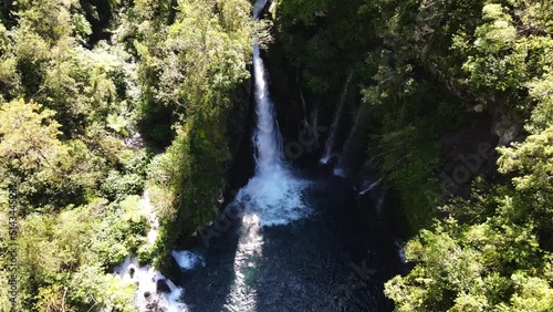 Drone footage of the Trou noir Langevin waterfall at the Reunion island. photo