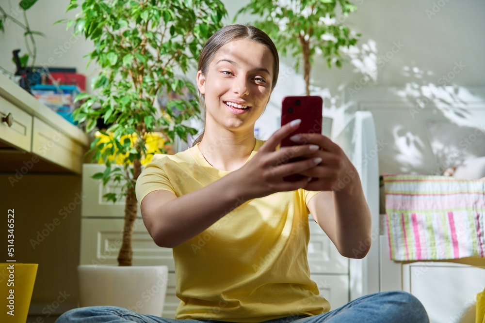 Teenage female using smart phone for conference chat video call Teenage female using smart phone for conference chat video call