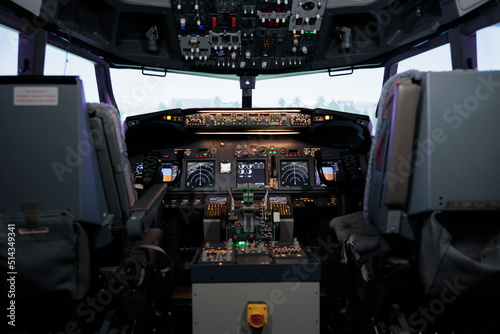 No people in empty plane cockpit with dashboard command and power buttons, switch, lever and handle. Nobody in cabin with control panel navigation and radar compass, engine throttle.