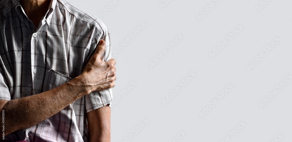 Pain in the shoulder joint of Asian man. Concept of frozen shoulder. Stock Photo | Adobe Stock