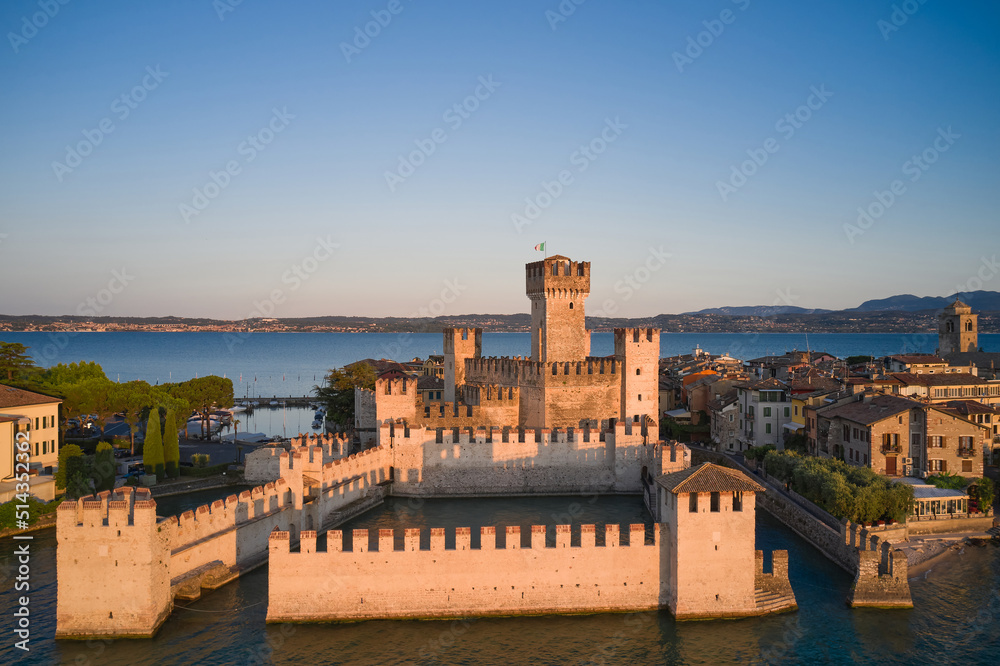 Aerial view of Scaligero Castle at sunrise. Sirmione aerial view on Lake Garda, Italy.