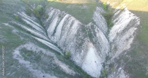 flying over beautiful white chalk hills with grass in summer